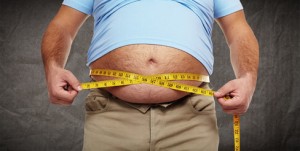 Fat belly. Man with overweight abdomen. Weight loss concept.